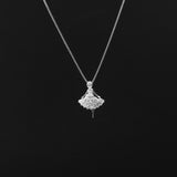 Silver necklace with a fan-shaped pendant on a black background