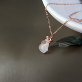 Necklace with a pendant on a neutral background