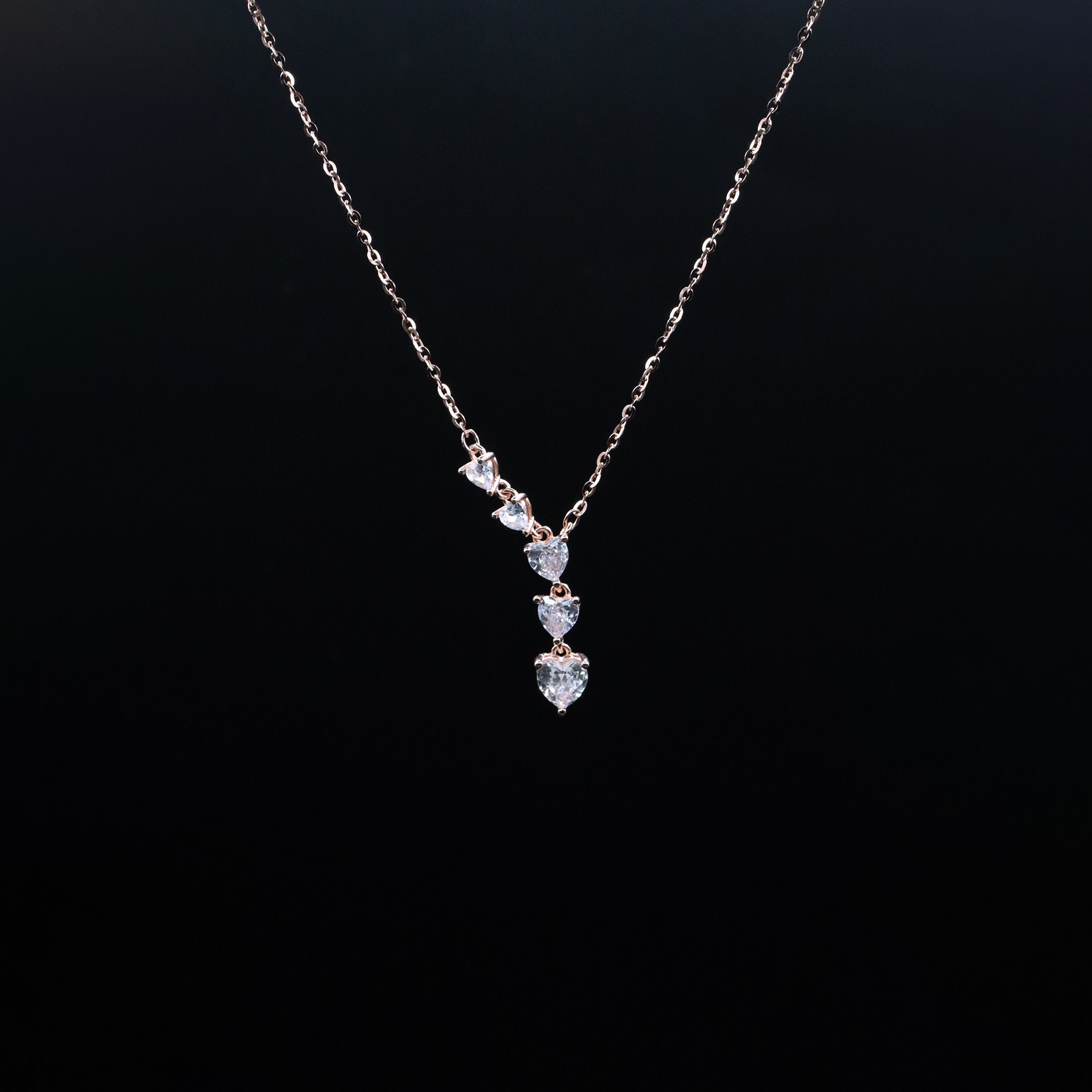 Necklace with diamond pendant on a black background
