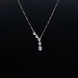 Necklace with diamond pendant on a black background