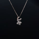 Silver reindeer pendant necklace on a black background