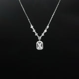 Diamond necklace with a rectangular pendant on a black background