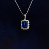 Sapphire pendant necklace on a dark background
