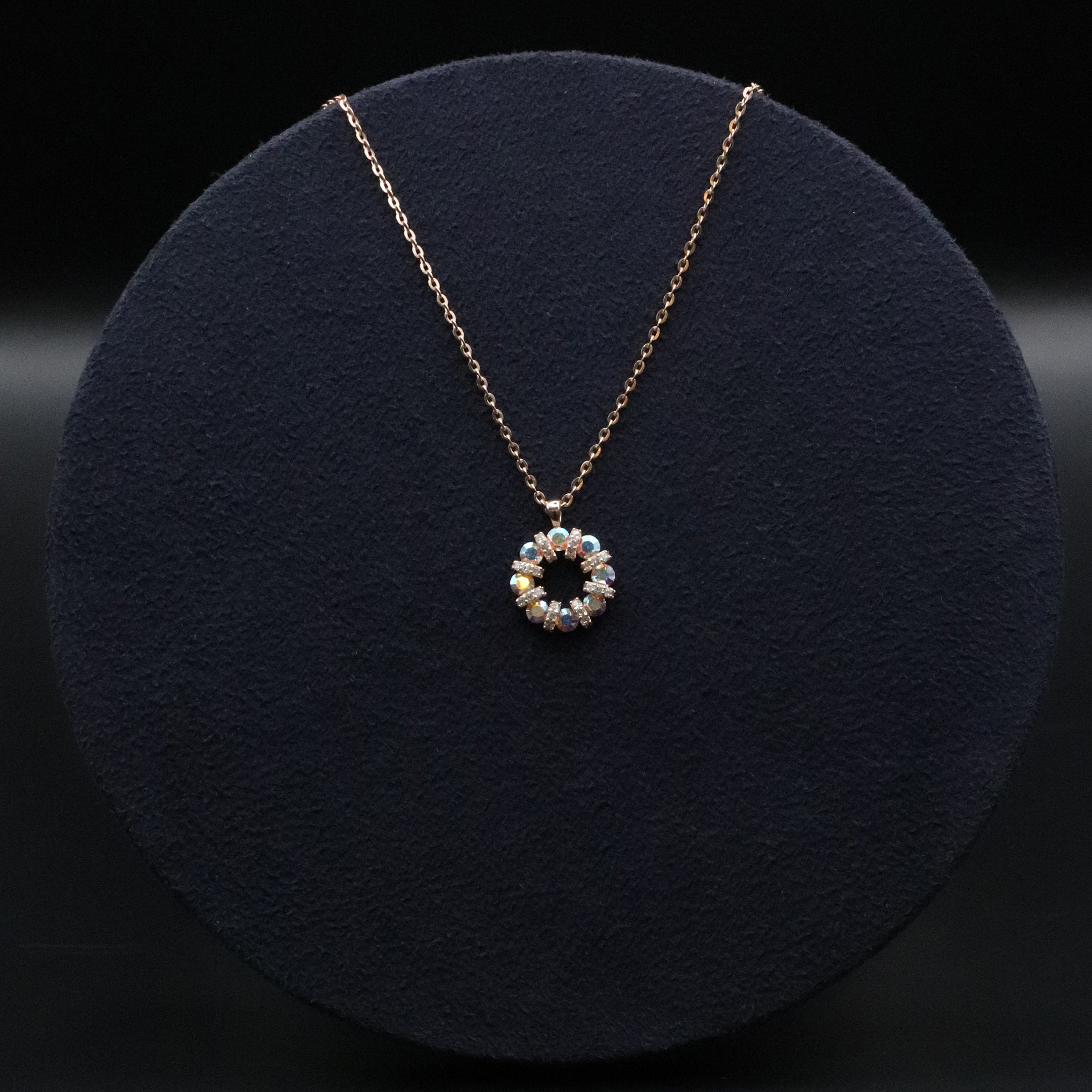 Necklace with a circular pendant on a dark background