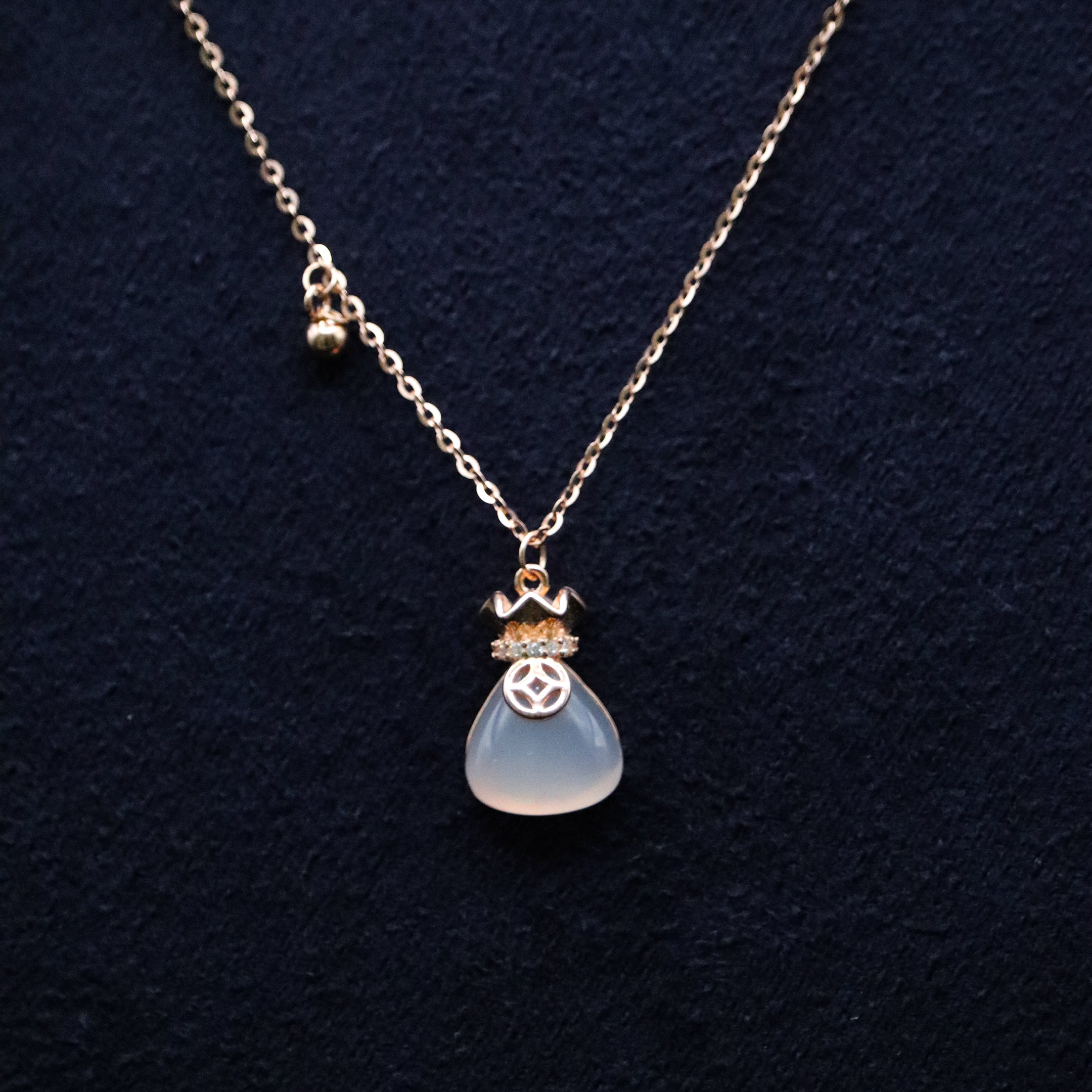 Necklace with a pendant on a dark background