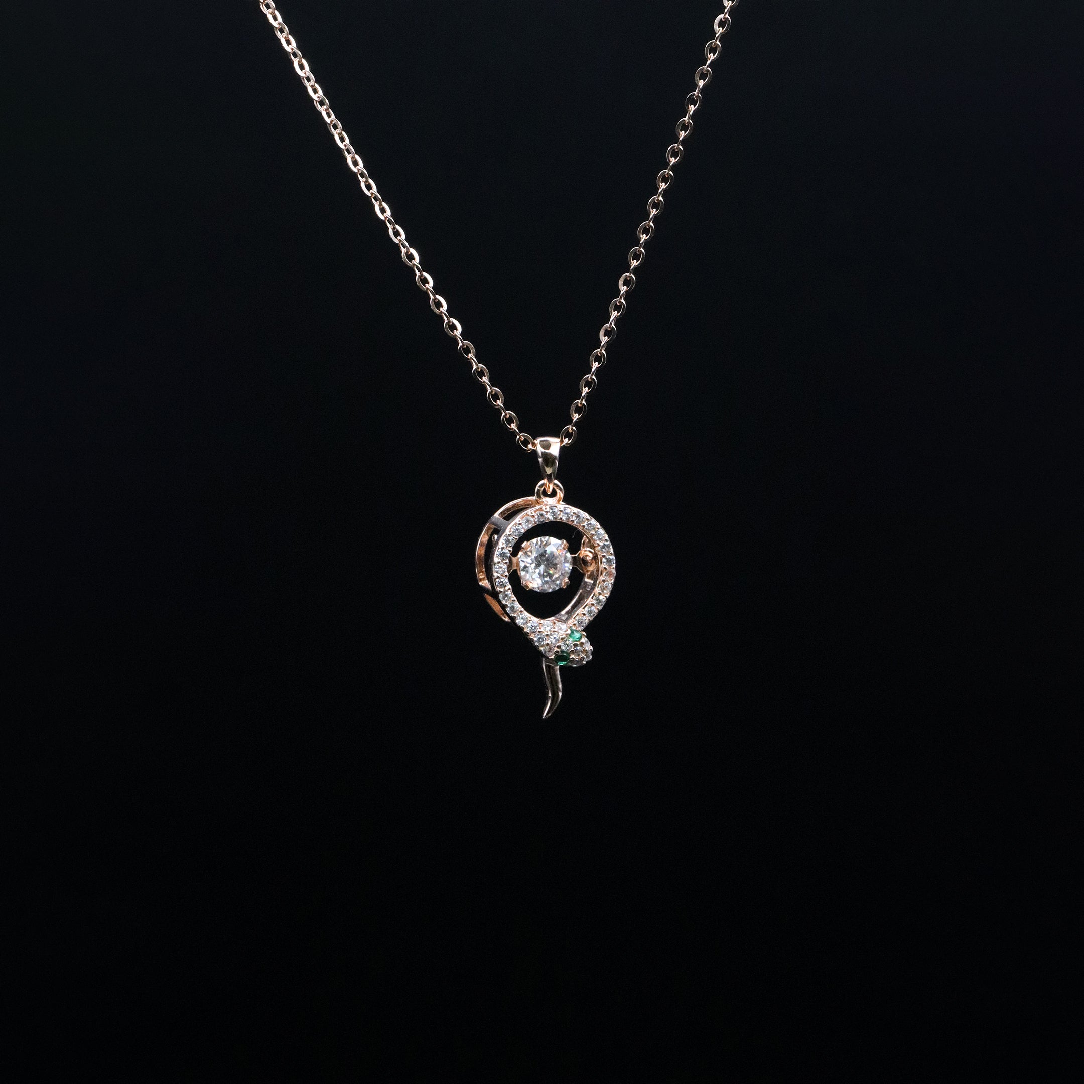 Necklace with a decorative pendant on a black background