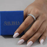 Hand wearing a diamond ring with a Shubha branded box in the background